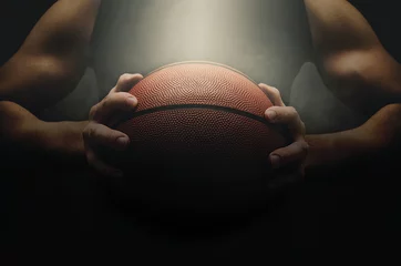 Gardinen Basketball player with ball over dark background © NatasaAdzic