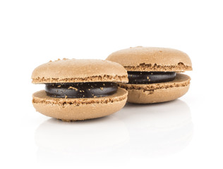 Chocolate French macarons isolated on white background two.