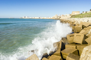 Atlantic waves crushing the waterbreaks in Cadiz, Andalusia, Spain