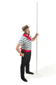 Caucasian man in traditional gondolier costume and hat
