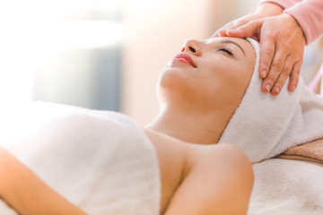 Fototapeta na wymiar Beautiful young woman spa on shoulder relaxing receiving massage,Spa concept