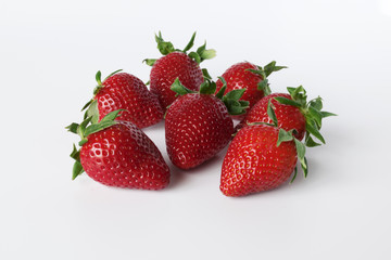 Closeup shot of fresh strawberries. Isolated on white background