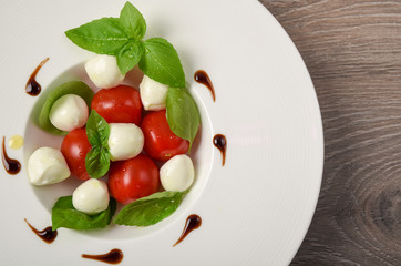 Caprese salad skewer with tomato, mozzarella and basil italian food and healthy vegetarian diet