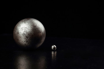 Obraz na płótnie Canvas Metal spheres on a black background. 
