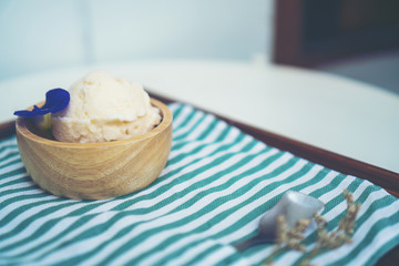 Homemade cherry ice cream on table
