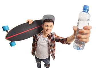 Teenager holding a longboard and a bottle of water © Ljupco Smokovski