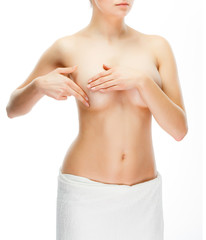 Fototapeta premium Woman examining breast isolated on white background