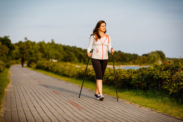 Nordic walking - young woman training