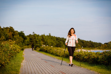 Nordic walking - young woman training