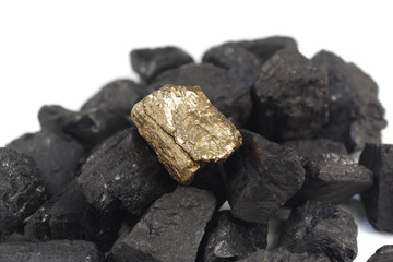 golden nugget on coals background