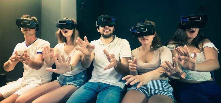 Group of friends  using virtual reality glasses