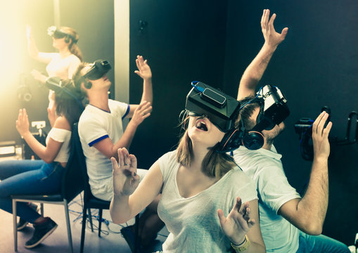 People having fun with vr headset goggles