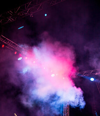 Color searchlight at a concert at night