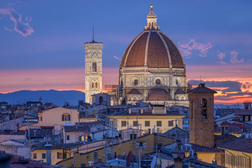 Fototapeta na wymiar Dome and bell tower of cathedral Santa Maria del Fiore in Florence, Italy