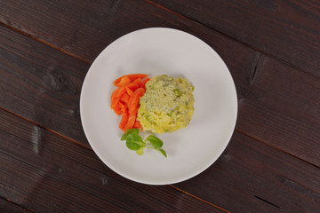 Rice with vegetables and herbs on a table