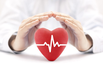 Heart pulse covered by hands. Health insurance concept 