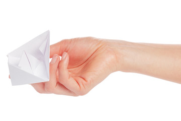 Paper ship in a female hand