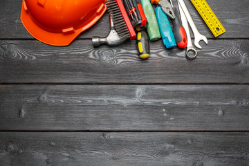 Assorted work tools on wooden table