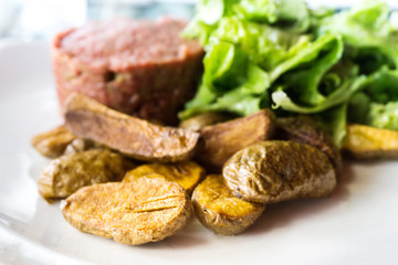 tasty Steak tartare (Raw beef) - classic steak tartare on white plate