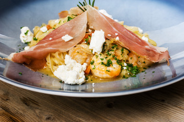 tasty pasta with roast ham on the table
