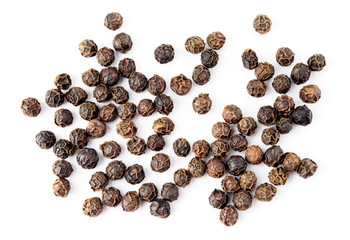 Black pepper. Peppercorns isolated on white. Macro. Top view.