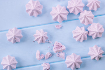 meringue on pastel colors background