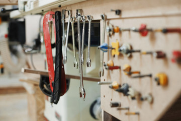 Set of various nozzles for electric drill in carpenters workshop