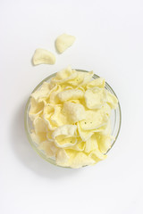 golden potato chips on a white background.