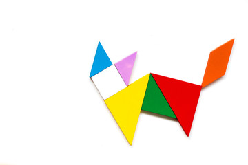 Fototapeta na wymiar Color wood tangram puzzle in cat shape on white background