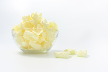golden potato chips on a white background.