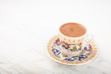 Traditional Turkish Coffee. Mocha on wooden background
