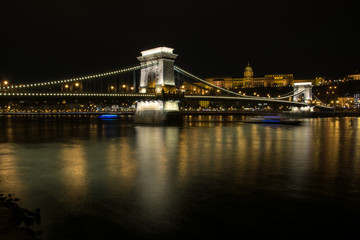 Fototapeta na wymiar The Chain Bridge with the Royal Palace in the background in Budapest at night