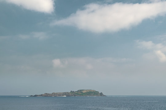 little island with turquoise sea at atlantic ocean in spain.