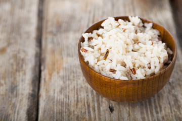 Boiled rice in a wooden bowl