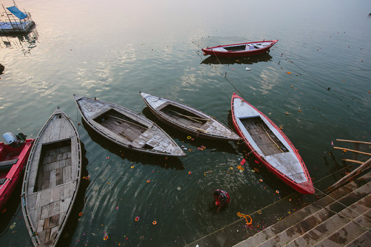 Old boats and swimming in Ganga river, Varanasi, India