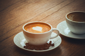 New hot latte coffee cup for replacing the empty cup; hot drink with copy space