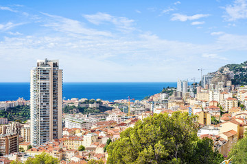 Fototapeta premium Daylight view from top to city hotel building and modern houses