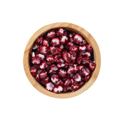 wooden bowl of purple hominy isolated on a white background