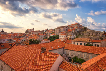 Fototapeta na wymiar Red tiled roofs of Dubrovnik Old Town, view from the ancient city wall. The world famous and most visited historic city of Croatia, UNESCO World Heritage site