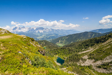 View from mountain Rippetegg to lake Untersee and distant Dachstein