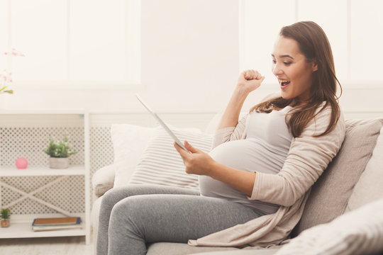 Pregnant business woman remote working at home