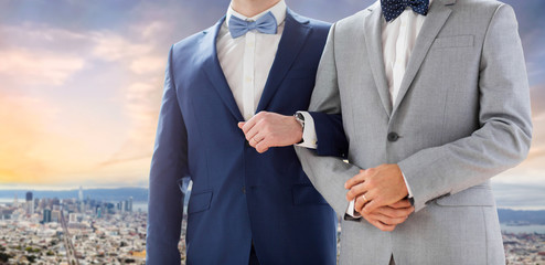 homosexual, same-sex marriage and tolerance concept - close up of happy male gay couple holding...