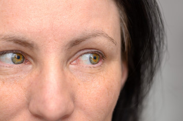Close up on the eyes of a woman looking left