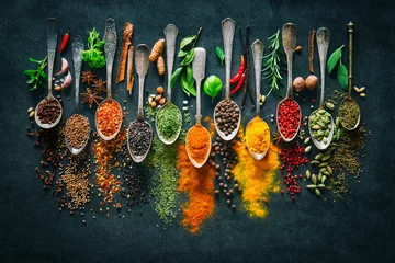 Wall murals Aromatic Herbs and spices for cooking on dark background