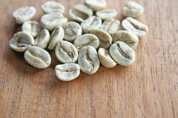 Freshness raw coffee on wood background