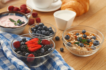 Rich breakfast on natural wooden table
