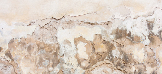 Fototapeta premium Old white plaster wall with cracked shabby surface texture background.