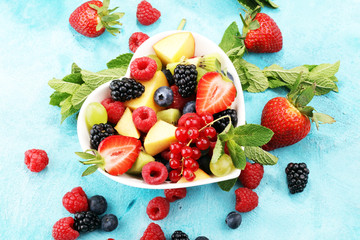 salad with fresh fruits and berries. healthy spring fruit salad