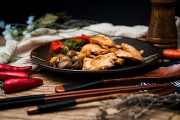 wok fried chicken stir fry with sweet peppers and chinese vegetables