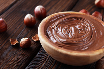 Homemade hazelnut spread in wooden bowl. Hazelnut Nougat cream